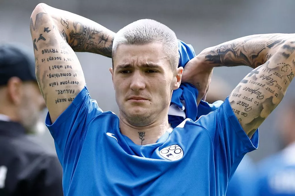 Benjamin Šeško Raised-arms photograph making the quotation and opposite cursive script tattoos easy to inspect Benjamin Šeško tattoos: Raised-arms photograph making the quotation and opposite cursive script tattoos easy to inspect