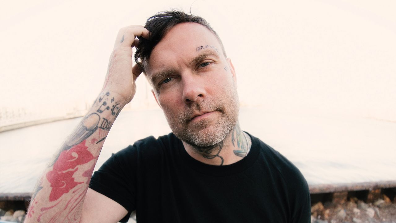 Bert McCracken tattoos: high-resolution view of neck, cheek and forearm tattoos