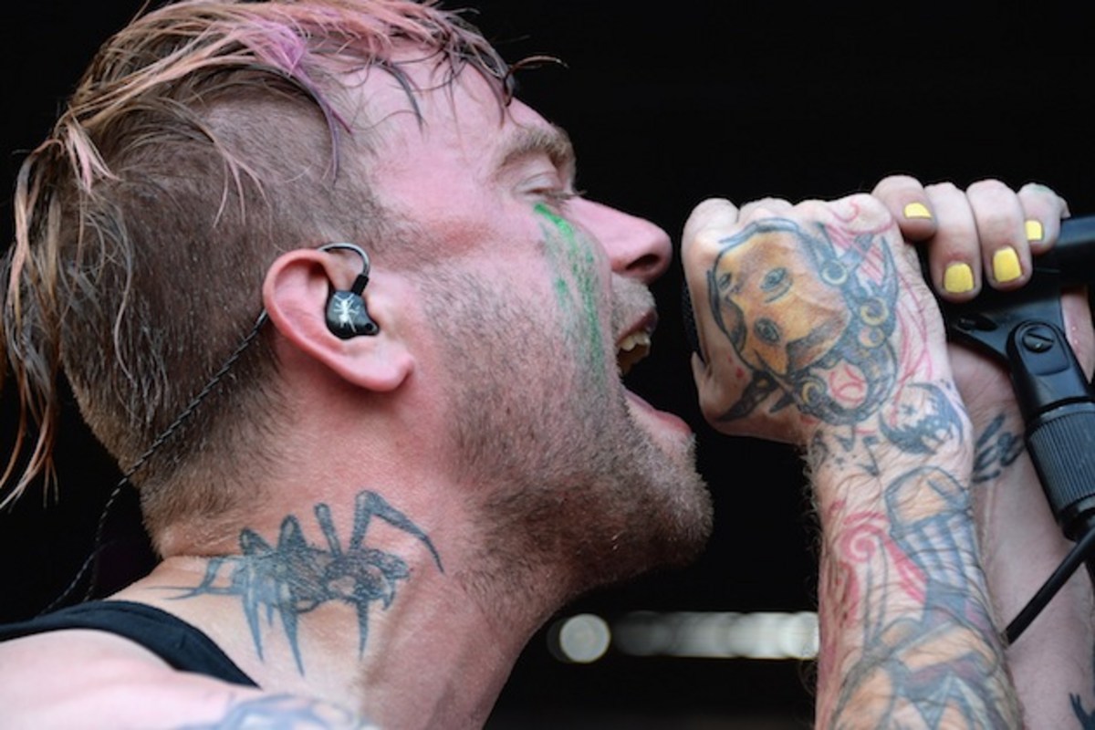 Bert McCracken tattoos: close-up of hand, wrist and neck tattoo details while performing