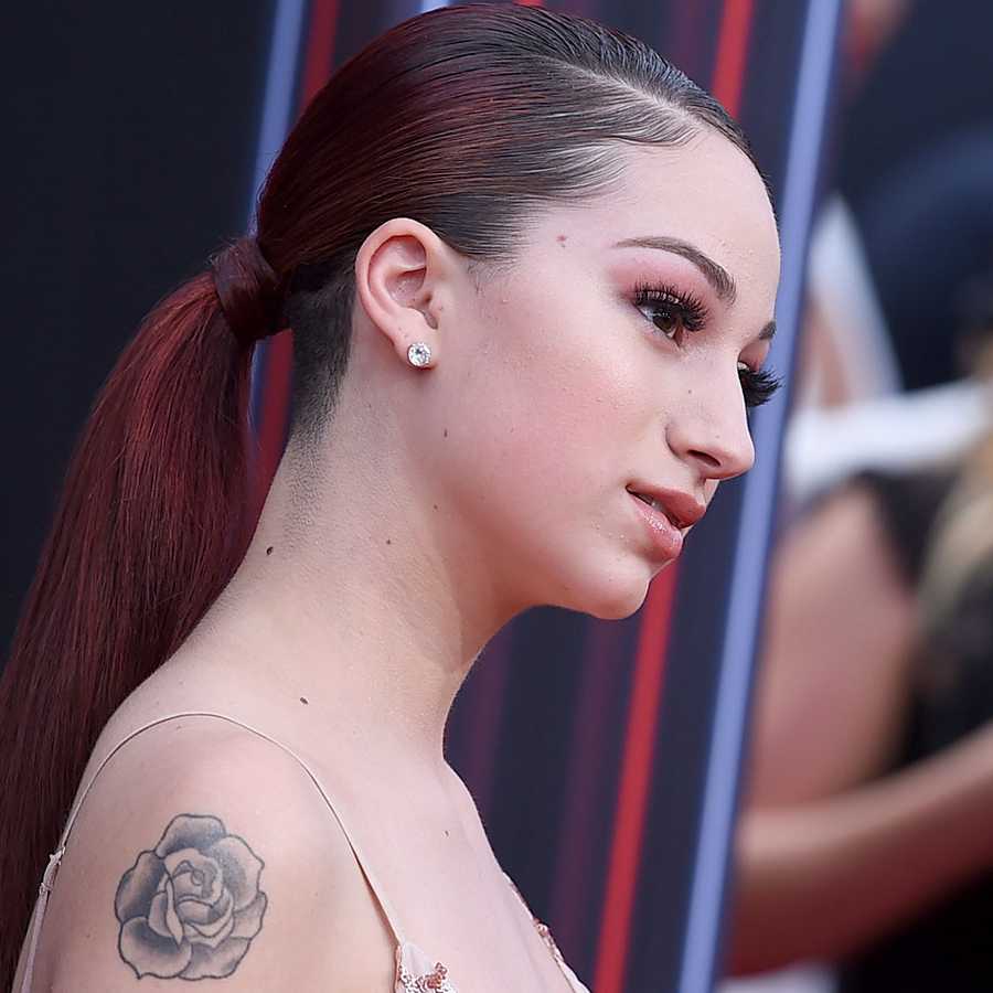 Bhad Bhabie tattoos: close event portrait showing the shoulder rose and nearby skin detail