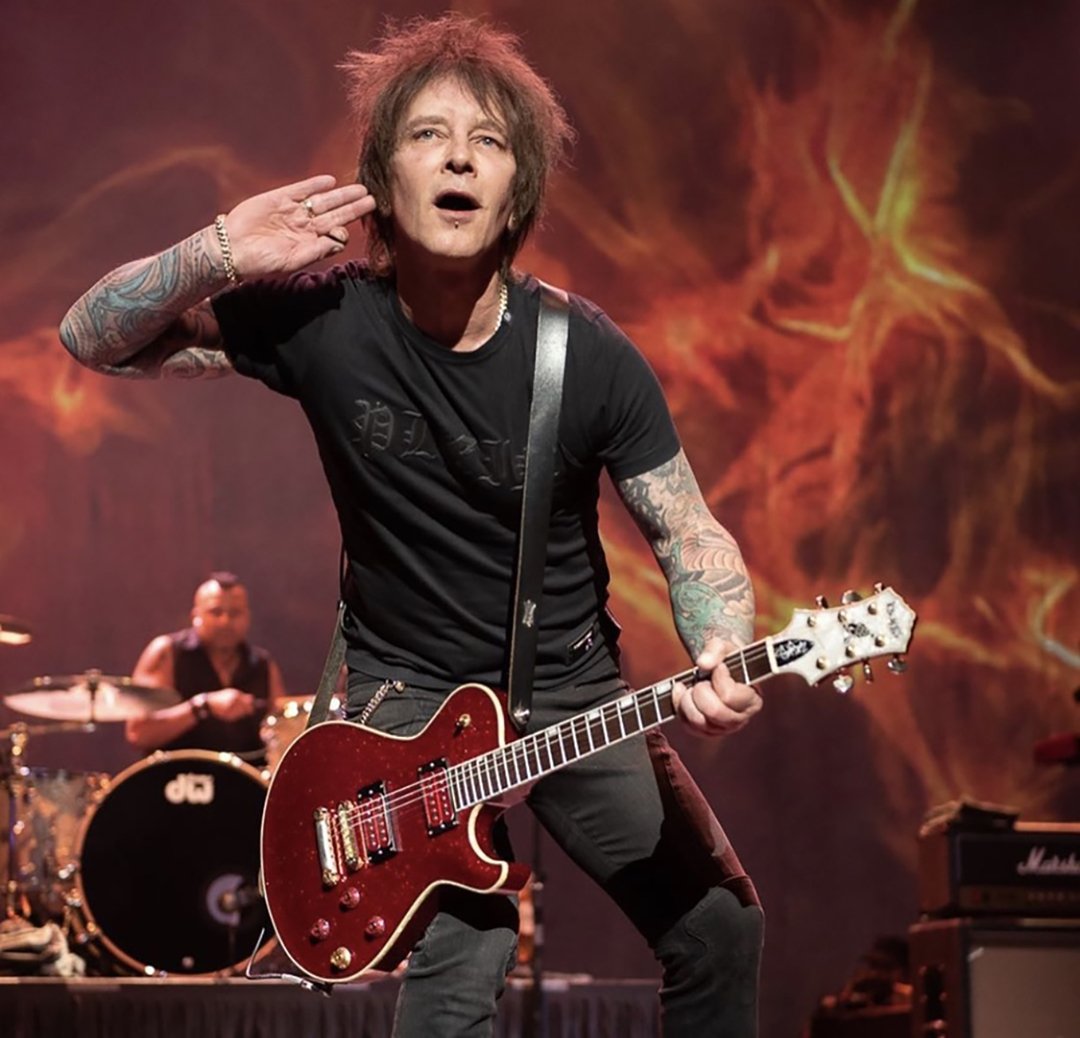 Billy Morrison arm tattoos on stage