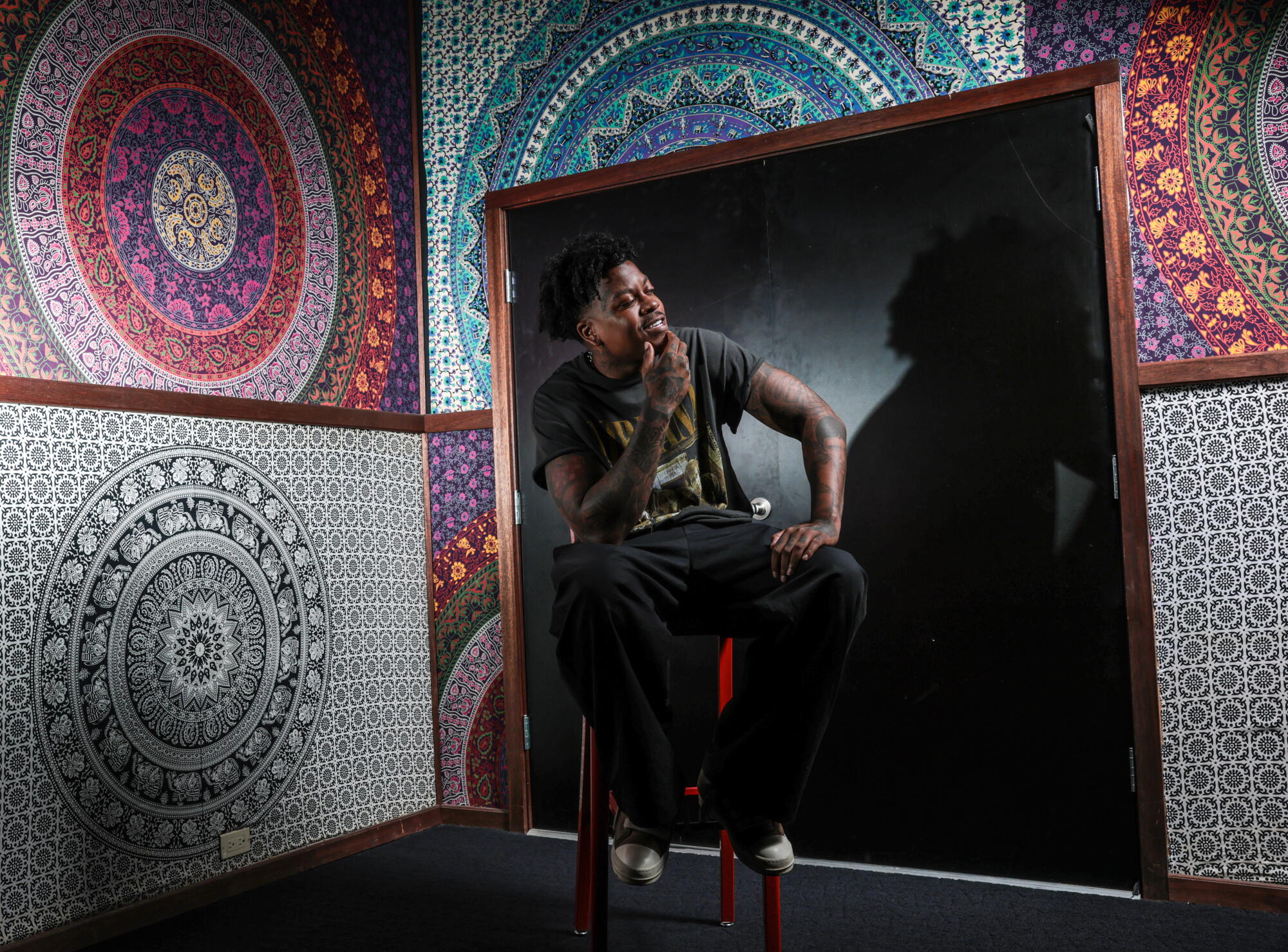 Bino Rideaux tattoos: Bino Rideaux's forearm and hand tattoo placement