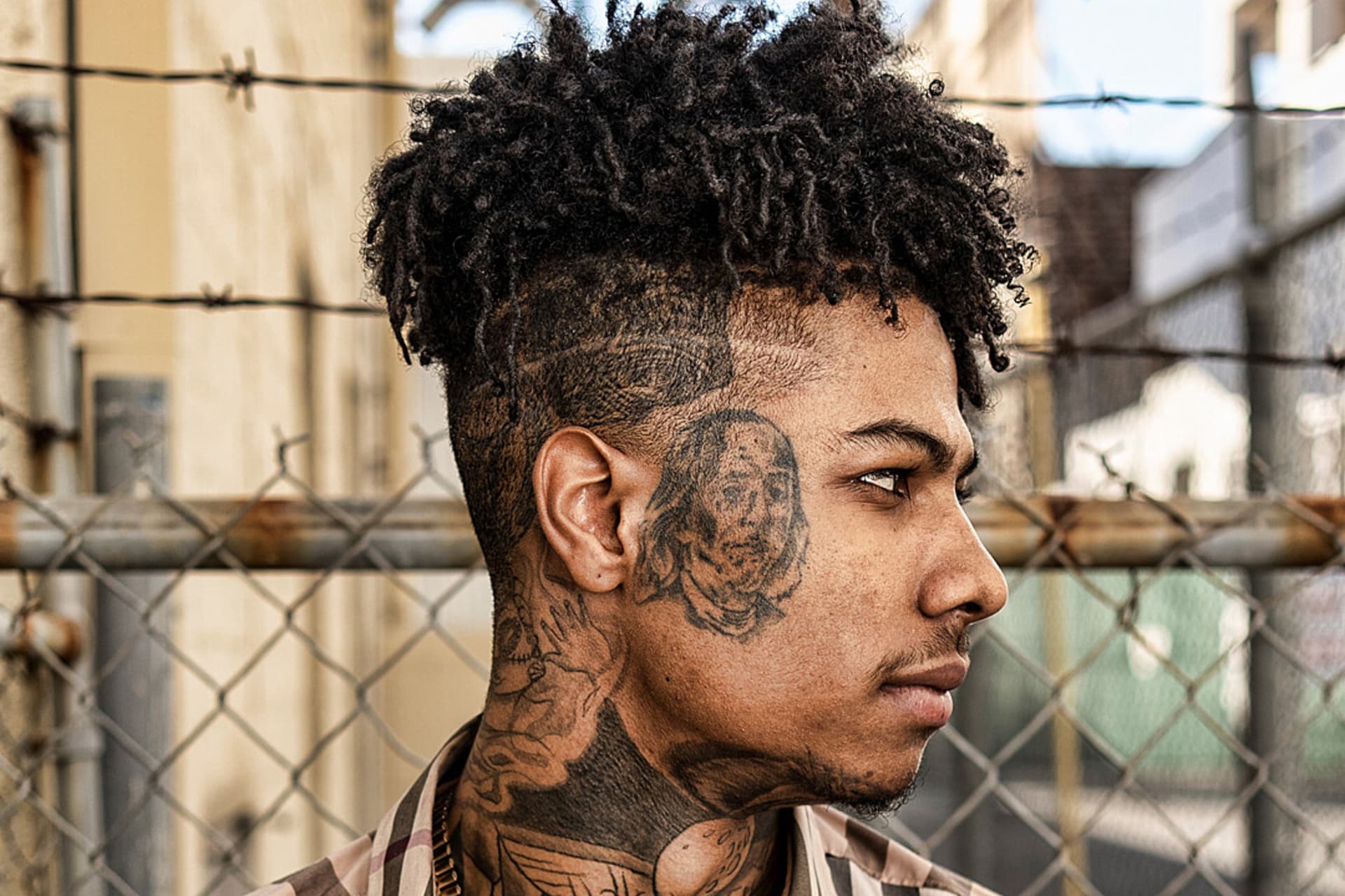 Blueface profile face tattoos