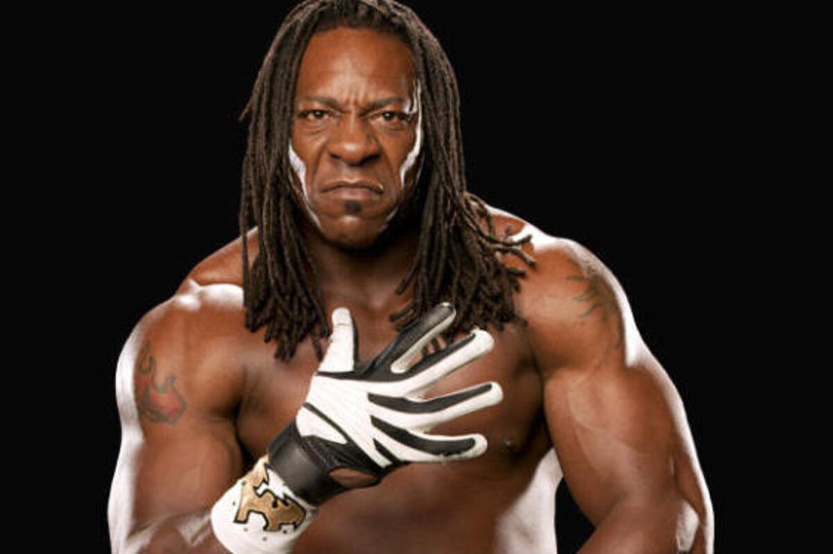 Booker T shoulder tattoos with face paint, wrestling portrait