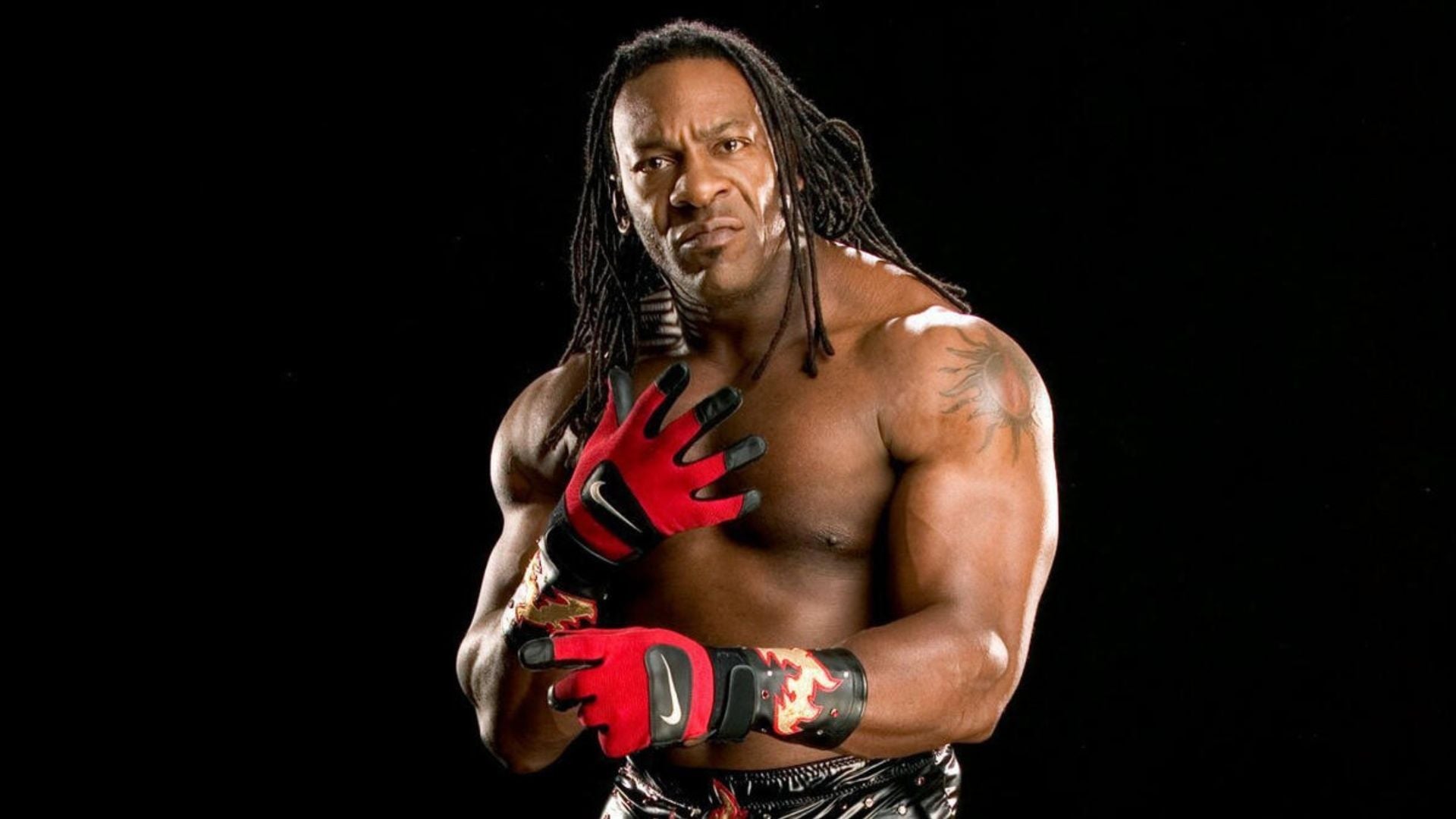 Booker T shoulder sun tattoo, clear shirtless wrestling portrait
