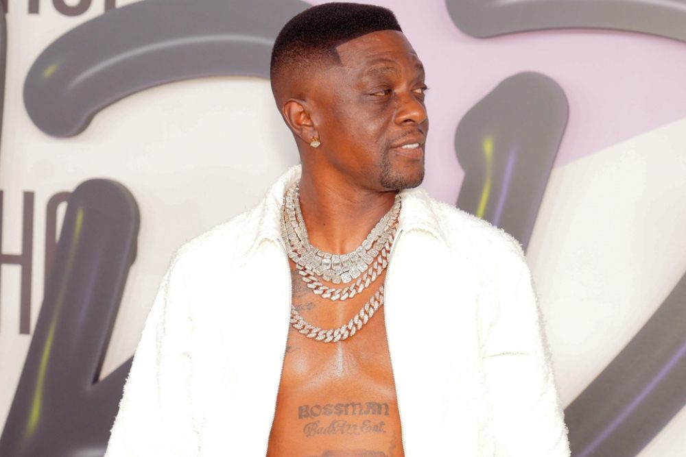 Boosie BadAzz tattoos: event portrait showing the Bossman BadAzz Ent. chest lettering