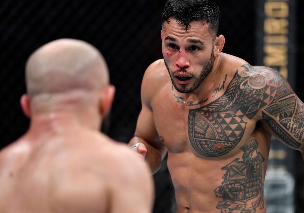 Brad Tavares tattoos: The chest pattern and shield illustration on his left side