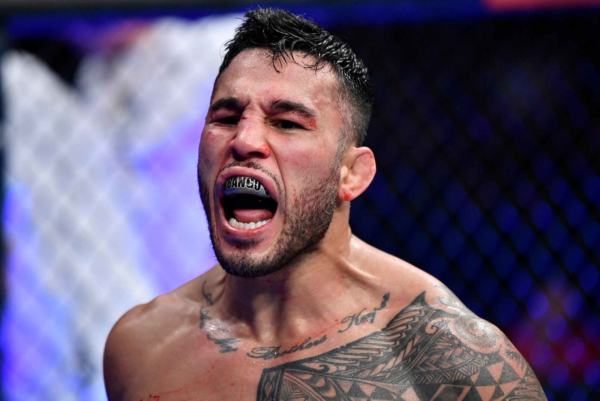 Brad Tavares tattoos: The script tattoo across his collarbones