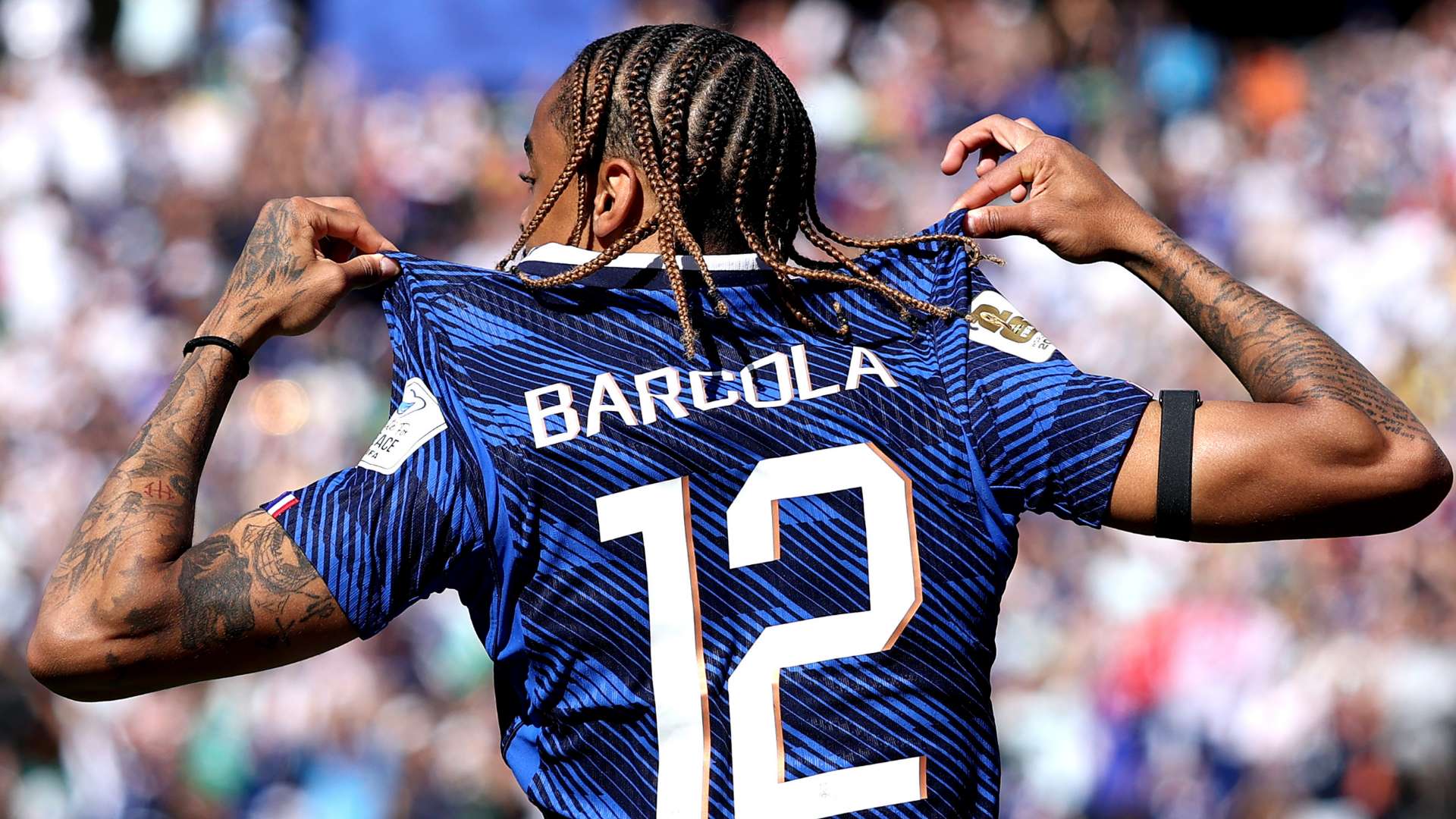 Bradley Barcola tattoos: Wide Goal football photograph showing Bradley Barcola’s back, arms and jersey in relation to the larger tattoo collection