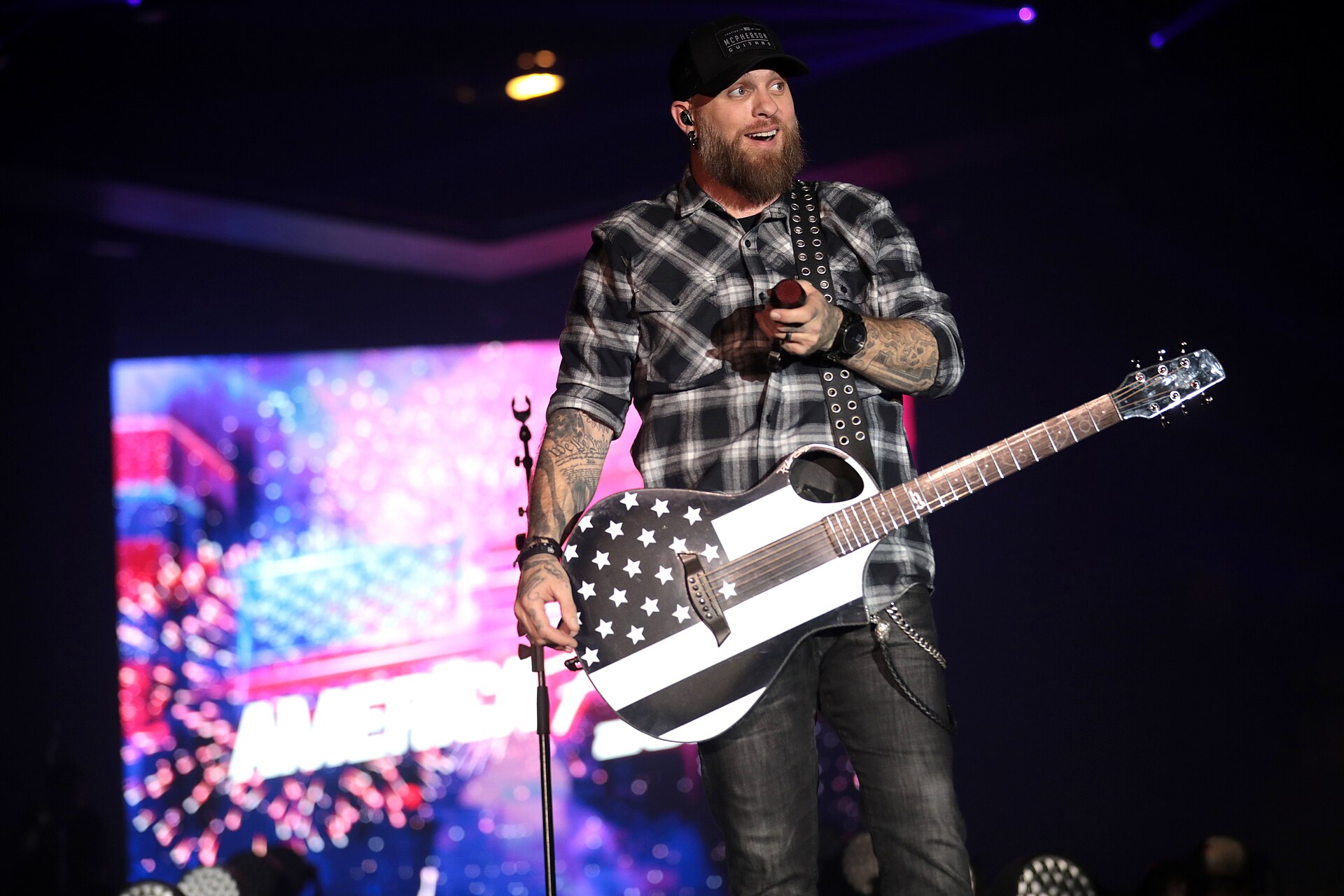 Brantley Gilbert forearm tattoos live on stage