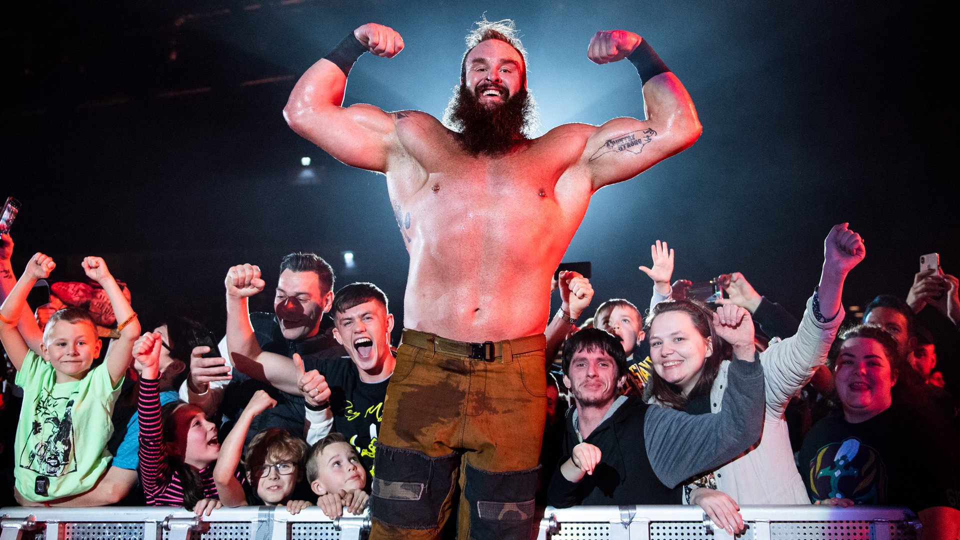 Braun Strowman tattoos: Country Strong lettering inside the left upper arm