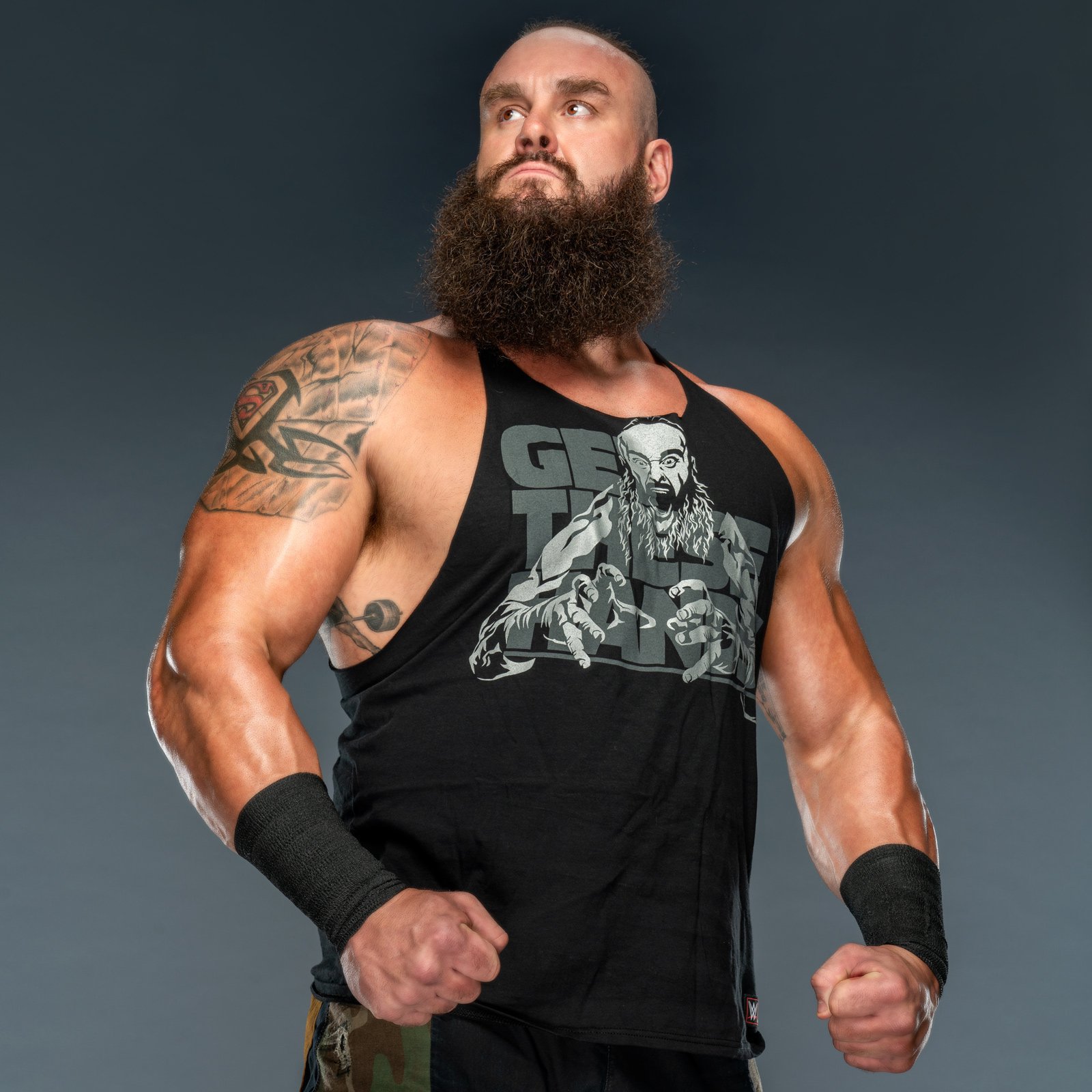 Braun Strowman tattoos: Red Superman emblem inside the right shoulder tattoo