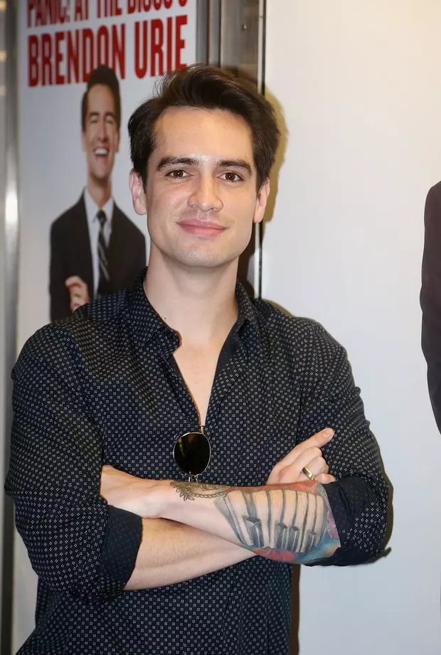 Brendon Urie tattoos: black-and-gray piano linework and forearm detail