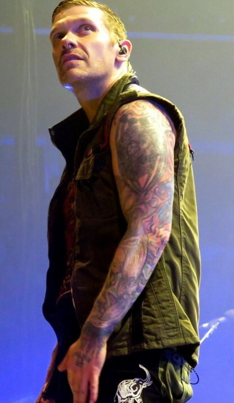 Brent Smith full arm sleeve tattoos during a performance