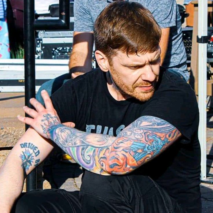 Brent Smith colorful backstage sleeve tattoos