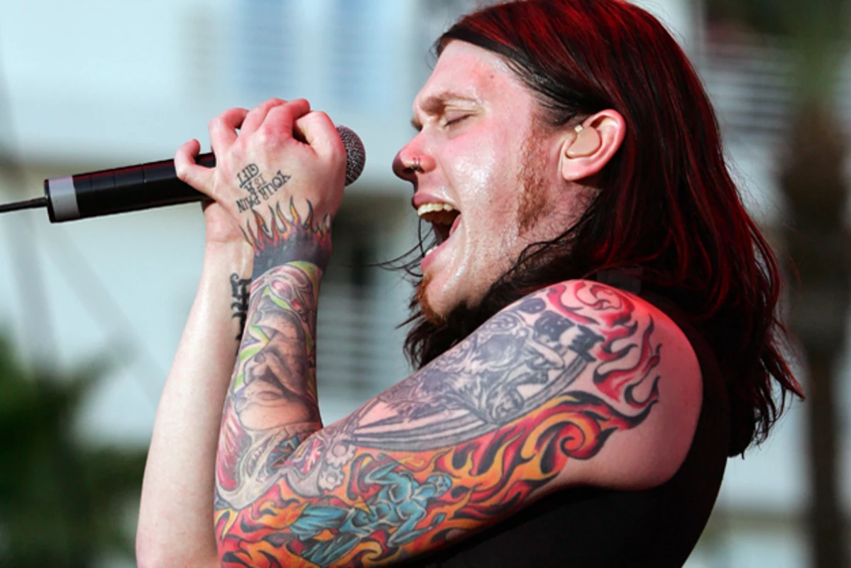 Brent Smith hand tattoo reading You Will Never Get It