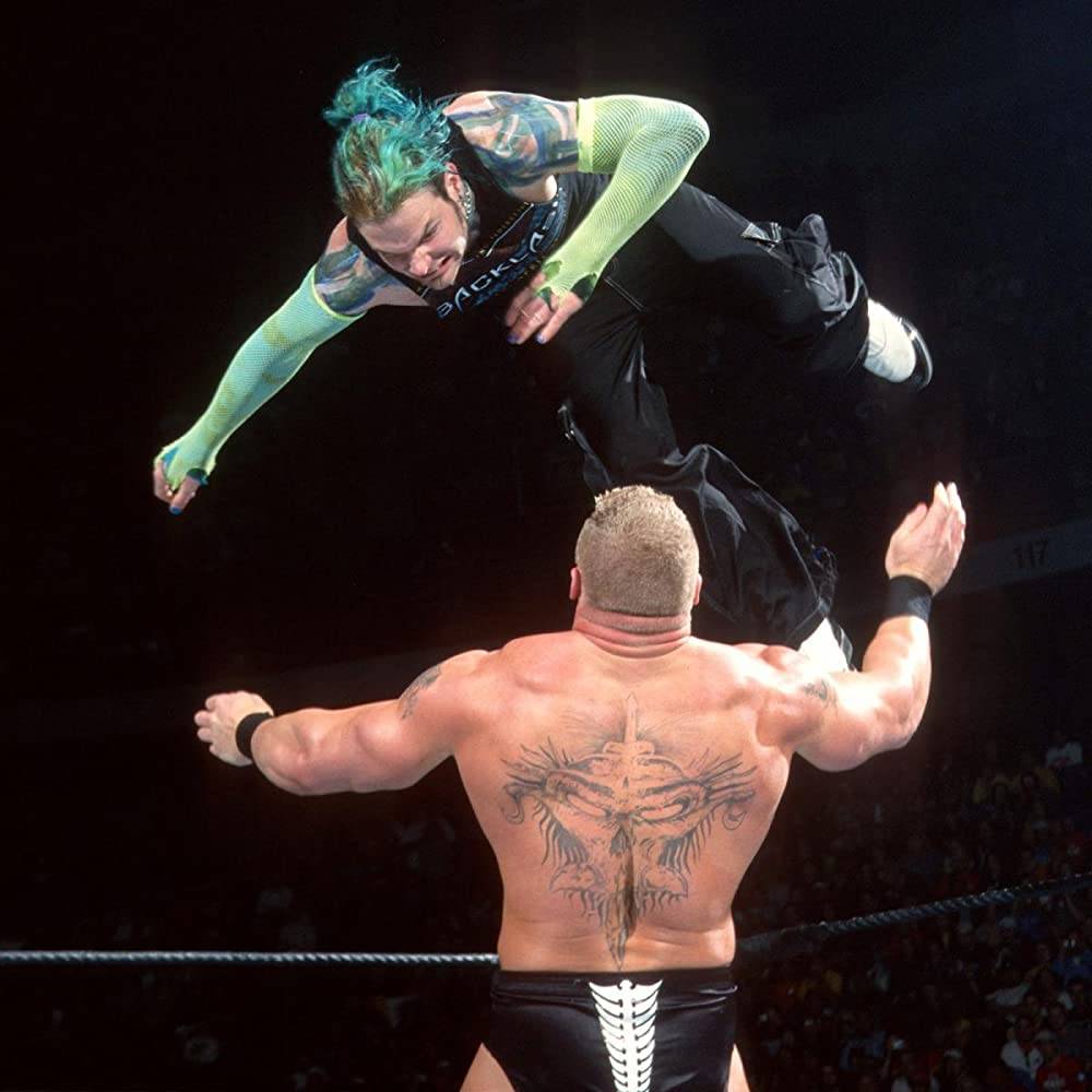 Brock Lesnar's large back tattoo visible during a match