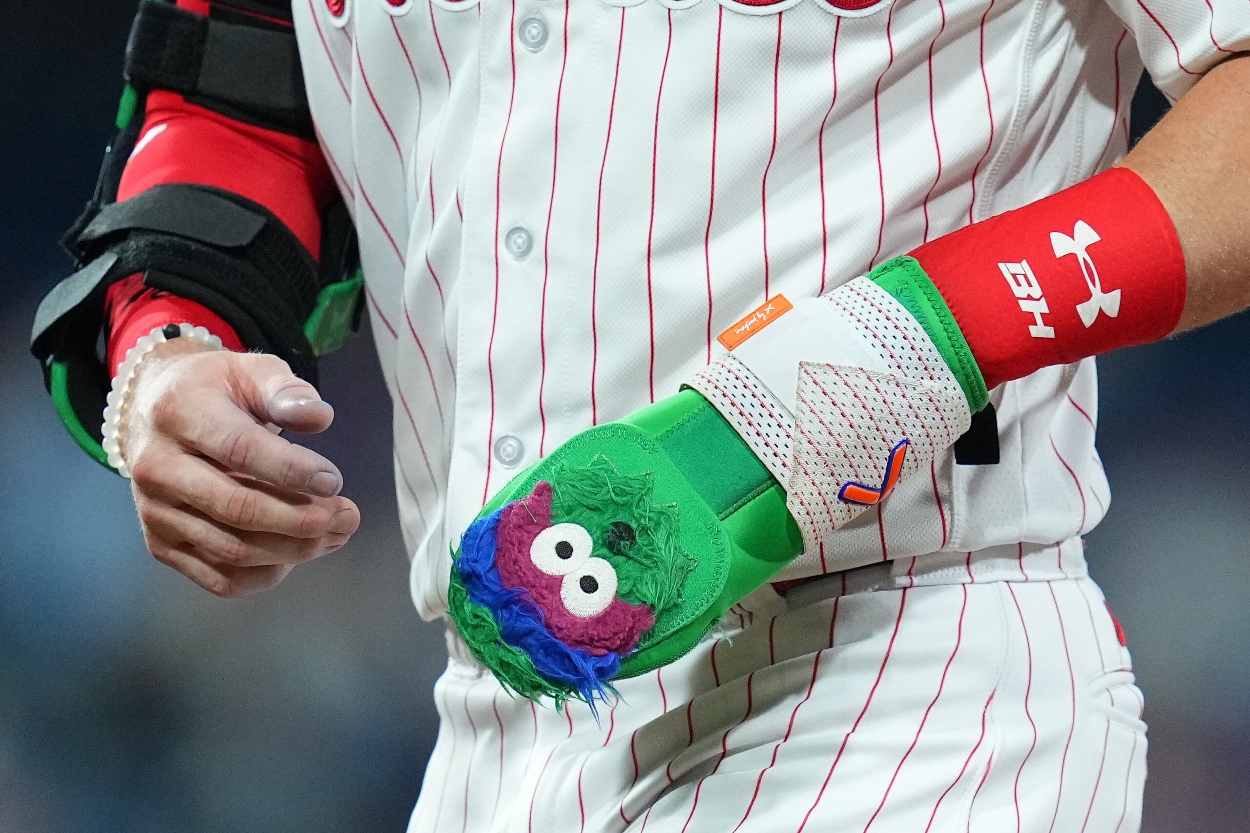 Bryce Harper in a contextual photograph: Harper in a contextual game photograph; this older image does not show his later tattoo and is not tattoo evidence; not tattoo evidence