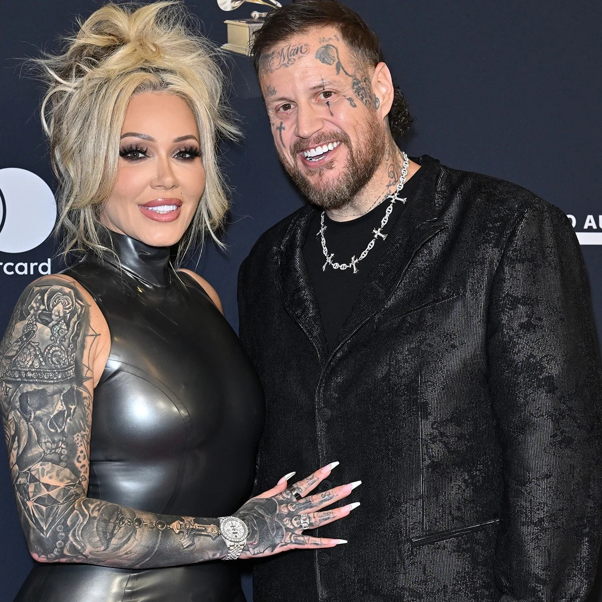 Bunnie XO and Jelly Roll at a music awards event Bunnie XO tattoos: Couple portrait with Bunnie's arm and hand tattoos clearly visible; supports the broader collection rather than claiming a close-up of one small design.