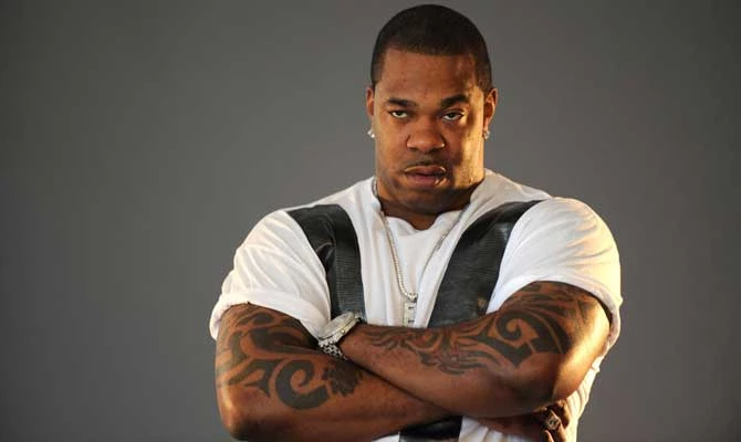 Busta Rhymes crossed arm tattoos