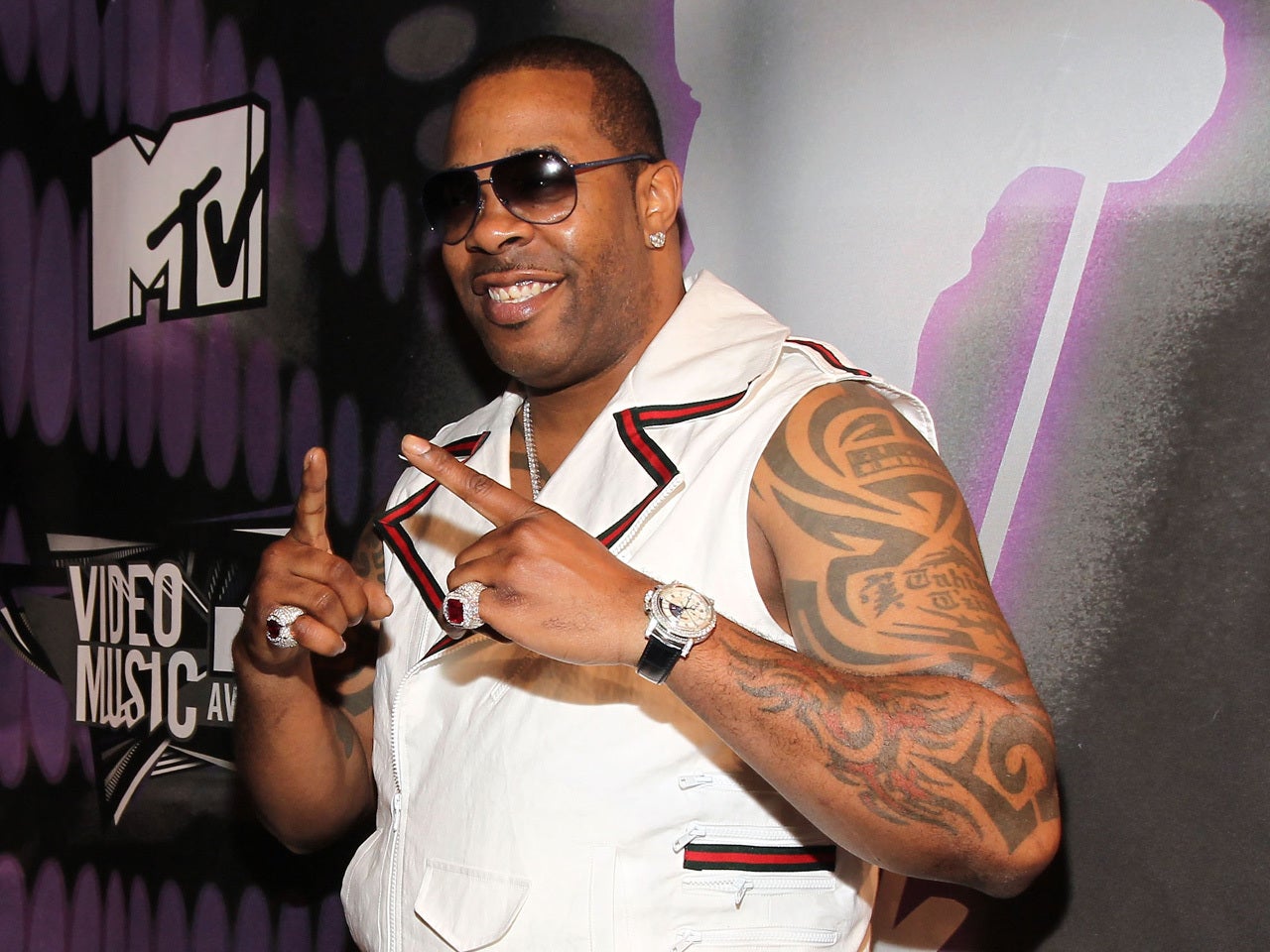 Busta Rhymes stage arm tattoos