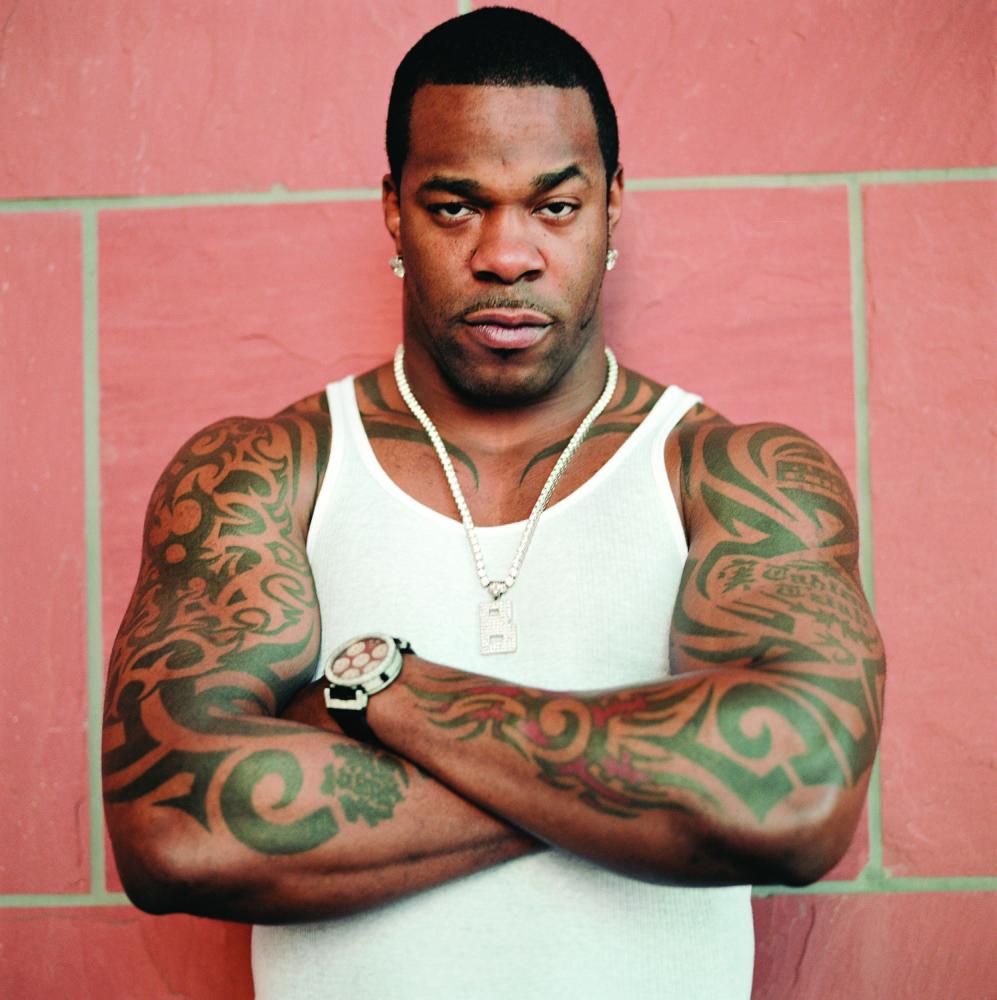 Busta Rhymes tribal arm tattoos