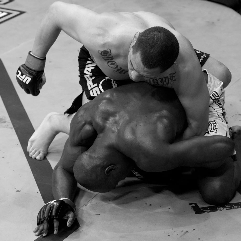 Cain Velasquez in a contextual photograph: A heavyweight built on repetition photograph; not tattoo evidence