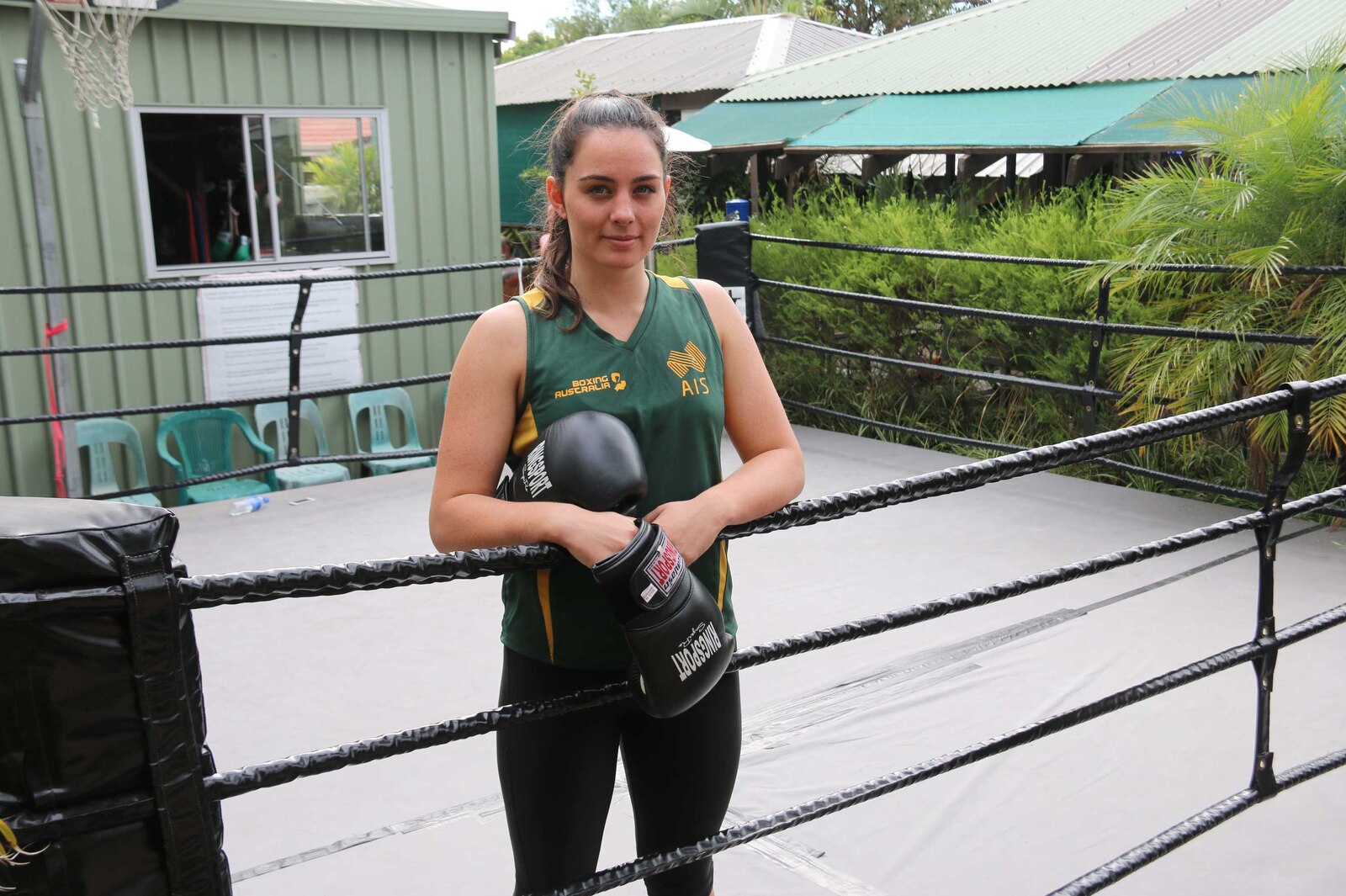 Caitlin Parker solo backyard boxing portrait Caitlin Parker portrait: solo backyard boxing portrait
