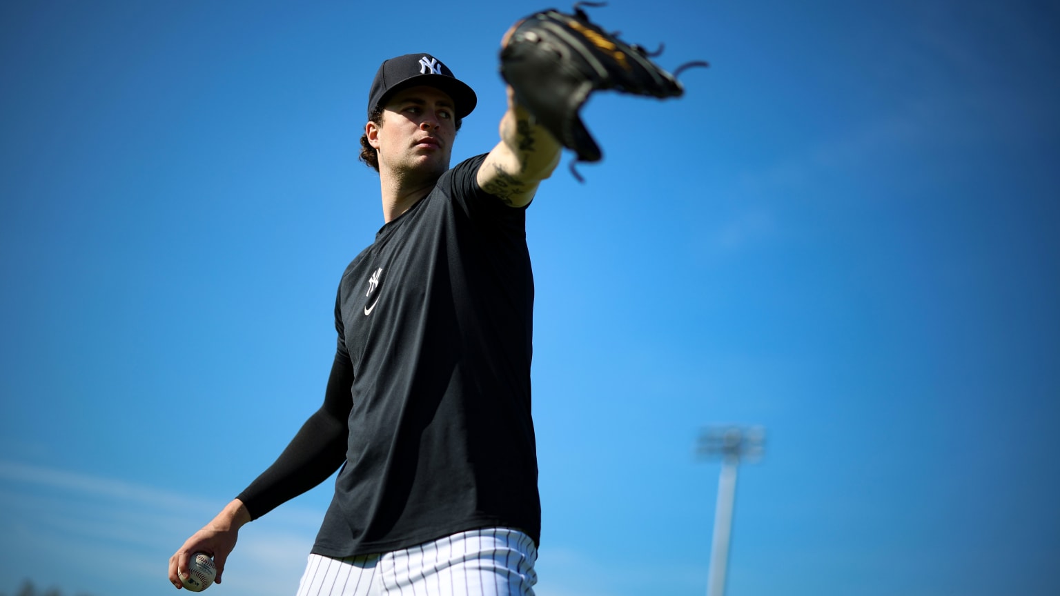 Cam Schlittler tattoos: Tattoo evidence: forearm tattoos visible while pitching.