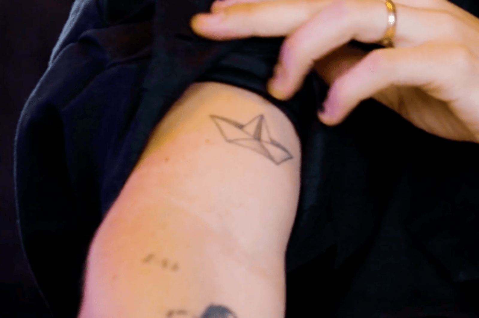 Camilo Camilo’s fine-line paper boat tattoo on his arm Camilo tattoos: Camilo’s fine-line paper boat tattoo on his arm