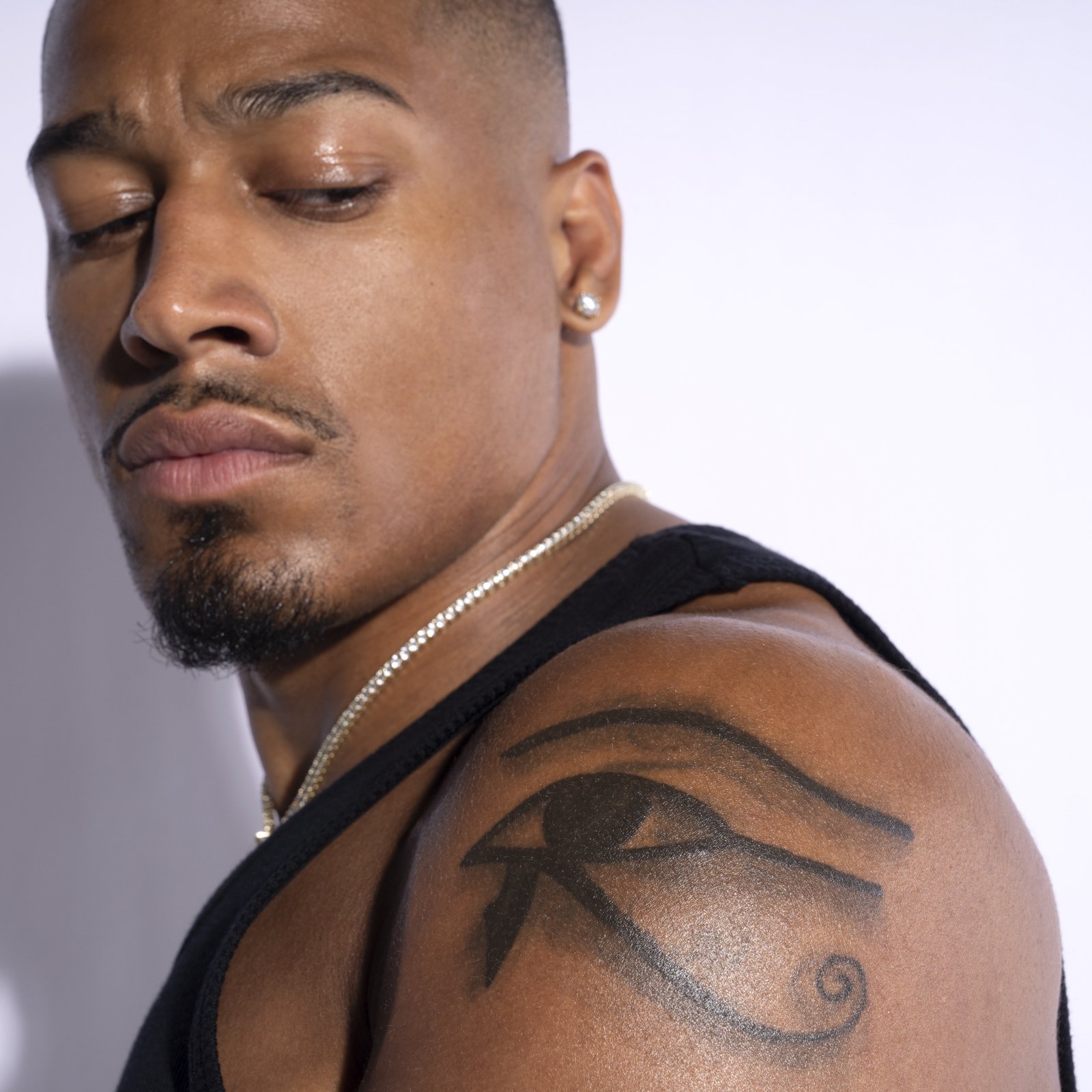 Carmelo Hayes tattoos: Eye of Horus shoulder tattoo
