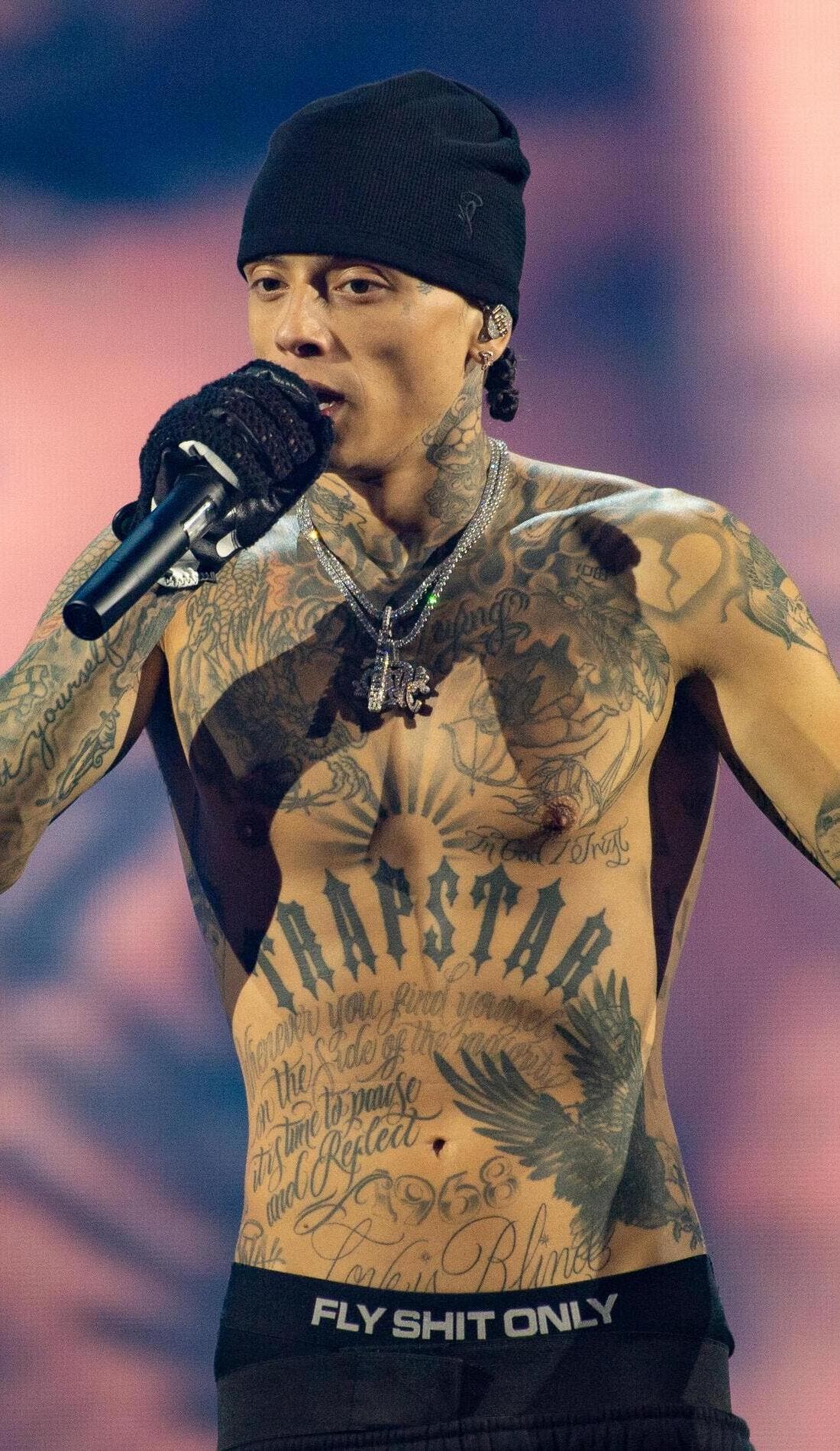 Central Cee tattoos: Trapstar chest lettering and full torso tattoos