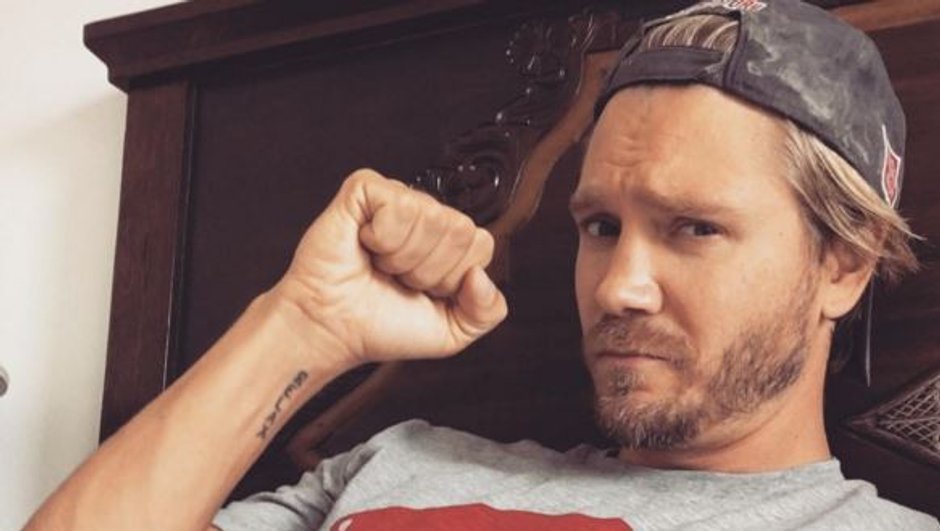Chad Michael Murray tattoos: Genuine face-visible photograph showing the small inner-wrist or forearm inscription.