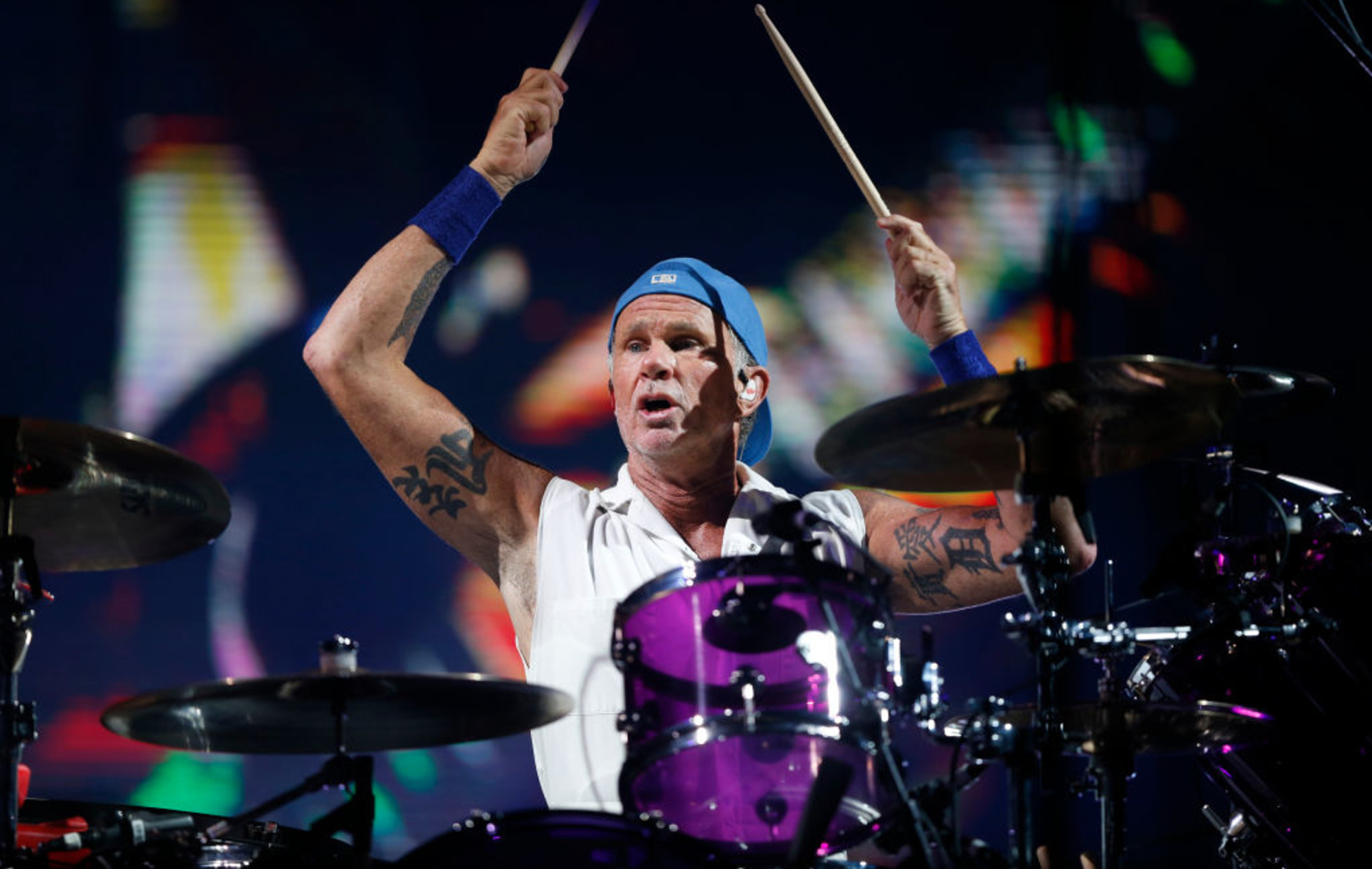 Chad Smith raised arm tattoos while drumming