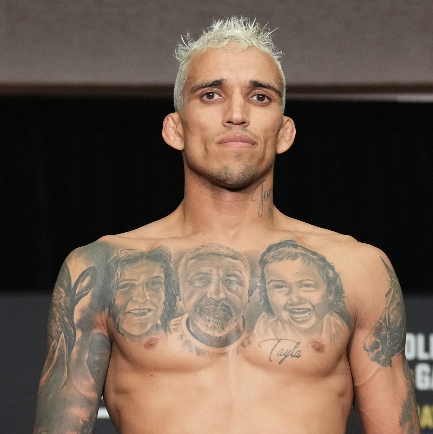 Charles Oliveira tattoos: family portraits and chest lettering