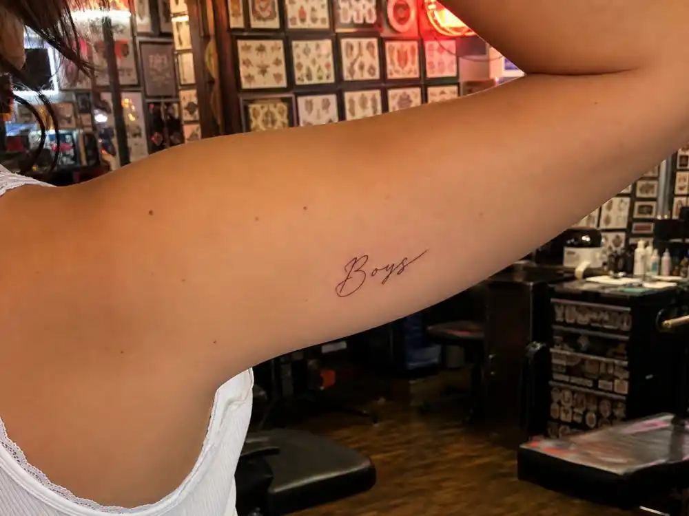 Close view of Charli XCX Boys tattoo Charli XCX tattoos: Inline tattoo evidence