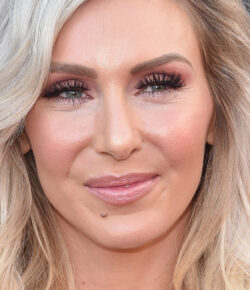 Charlotte Flair Tattoos: Her Reider Memorial Cross and Its Meaning