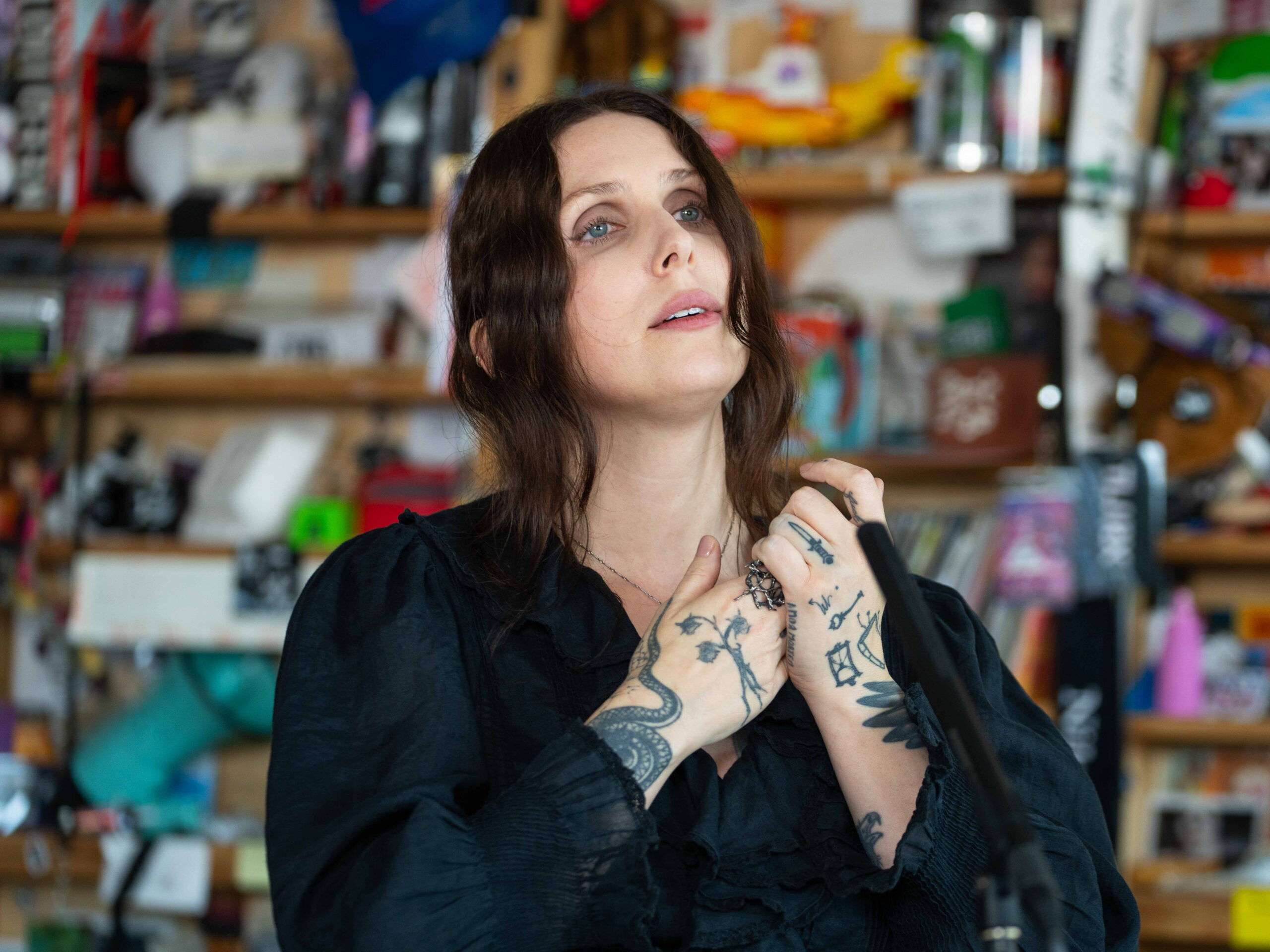 Chelsea Wolfe tattoos: a high-resolution portrait showing the darker arm and hand work together