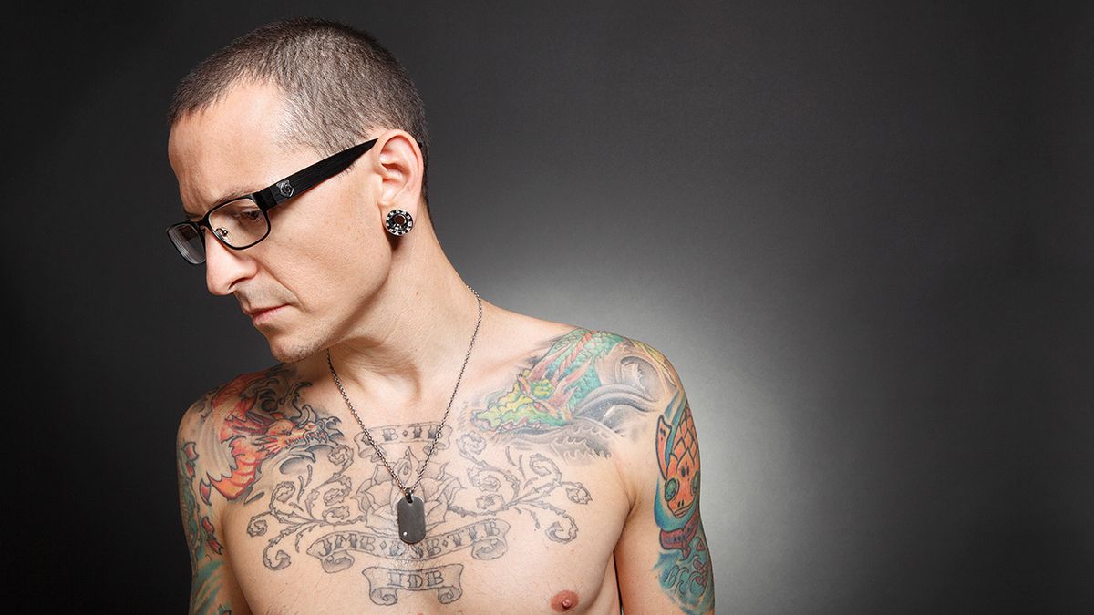Chester Bennington colorful chest and shoulder tattoos portrait