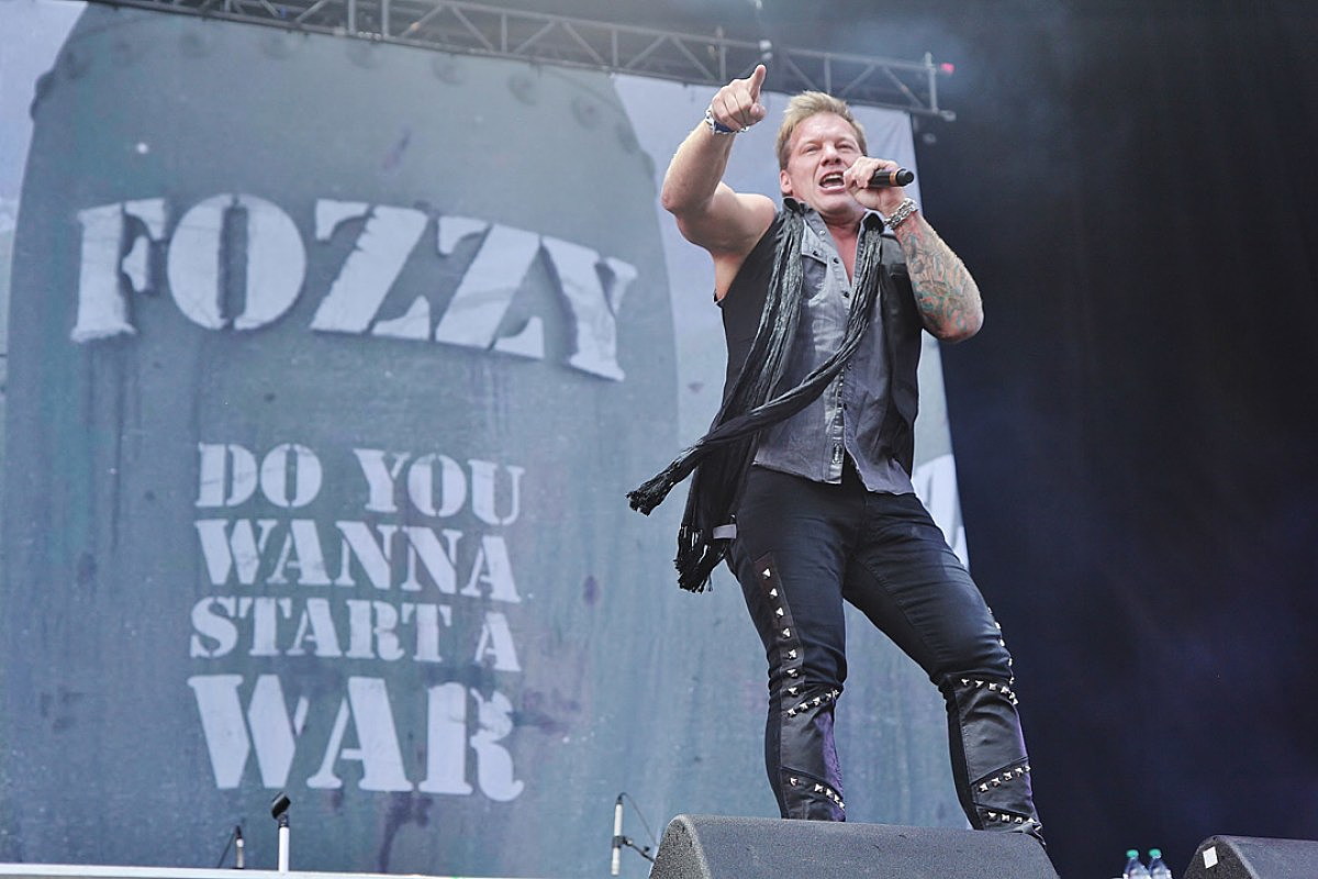 Chris Jericho performing with his tattooed arm visible