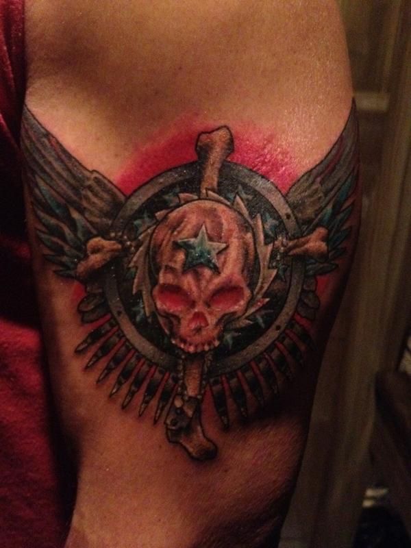 Chris Jericho skull and wings tattoo