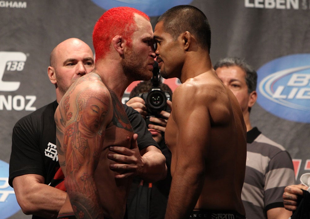 Chris Leben tattoos: The Buddha and flowers on his right arm