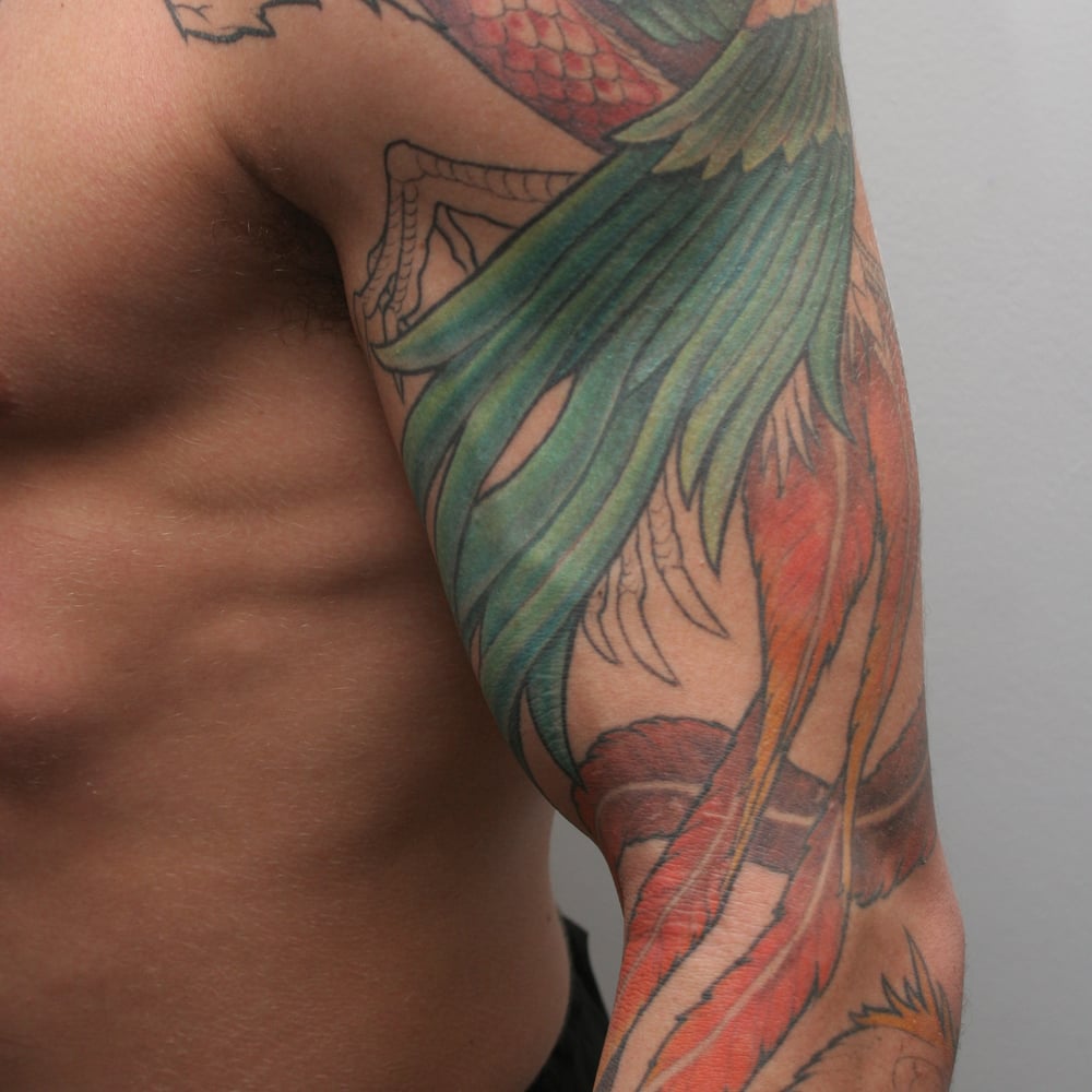 Chris Leben tattoos: The phoenix flowing down his left arm