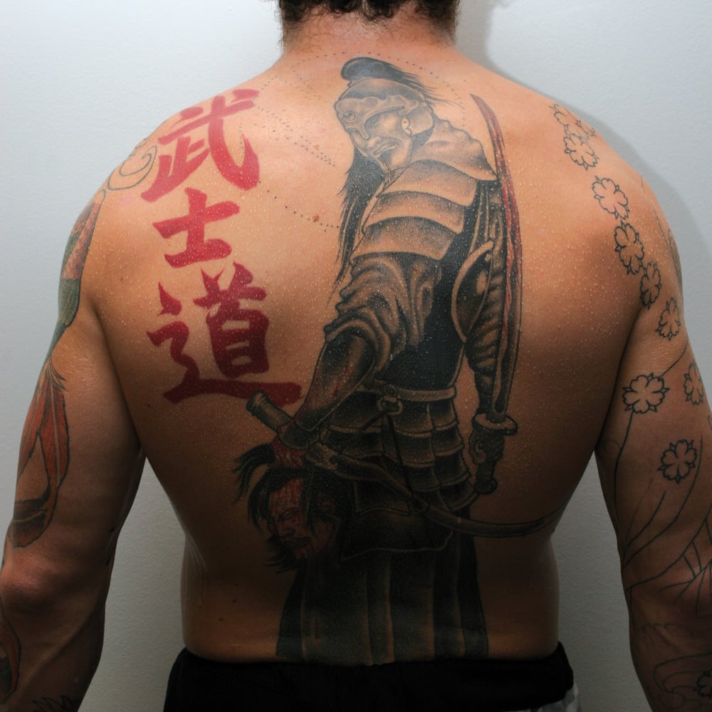 Chris Leben tattoos: The samurai and red lettering on his back