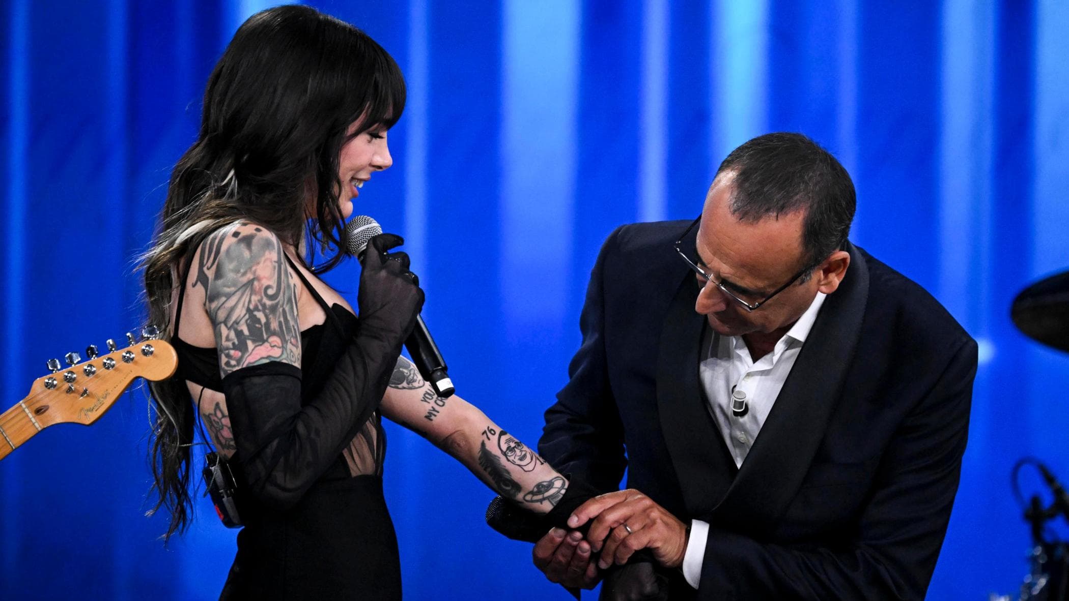 Cleo tattoos: existing black-and-grey sleeve and forearm tattoos at the Sanremo Top appearance