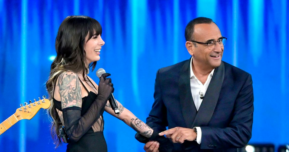 Cleo tattoos: separate published view of the tattooed arm and Carlo Conti forearm portrait