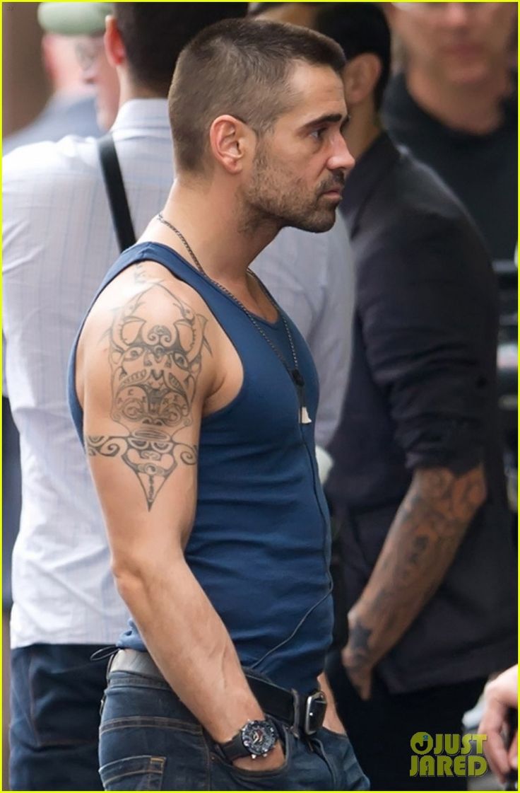 Colin Farrell tattoos showing the large tribal design on his upper arm