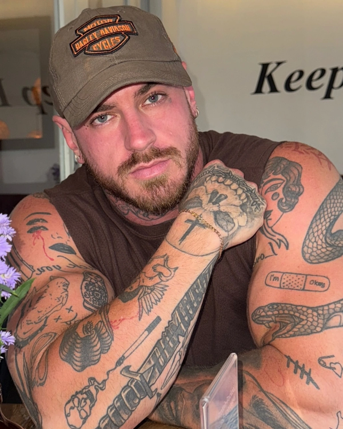 Cooper Black tattoos: Close portrait showing the dense arm, hand and shoulder tattoo group