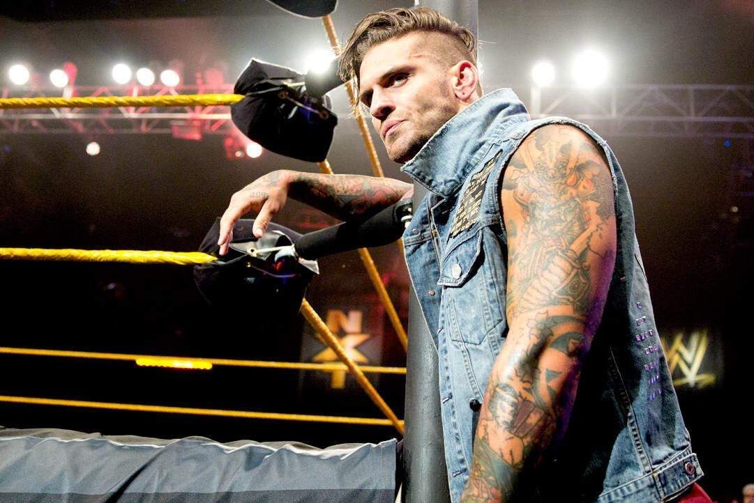 Corey Graves tattoos: distinct ringside side-view with the arm tattoo sleeve clearly visible