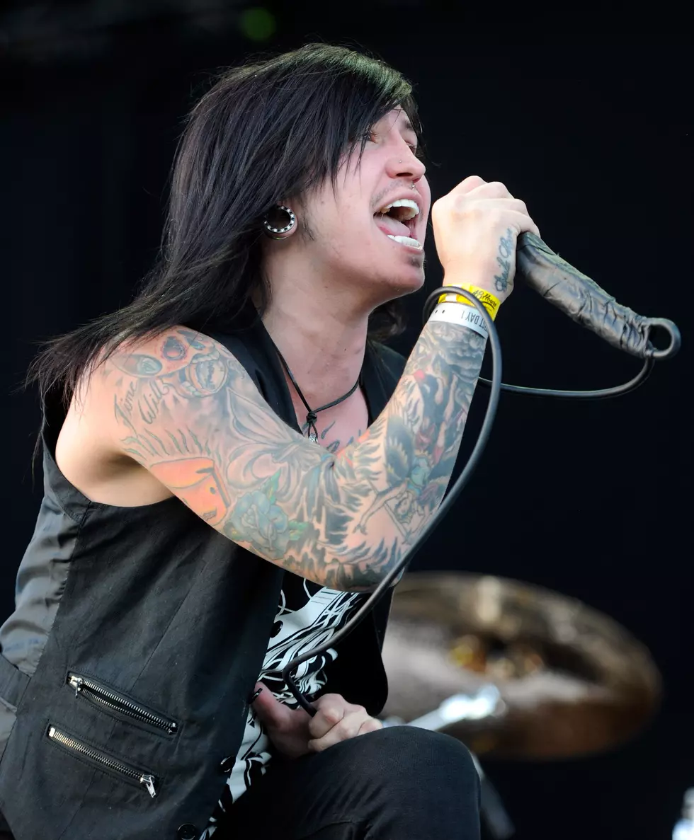 Craig Mabbitt tattoos: separate high-resolution action photograph showing the sleeve wrapping around the arm in motion